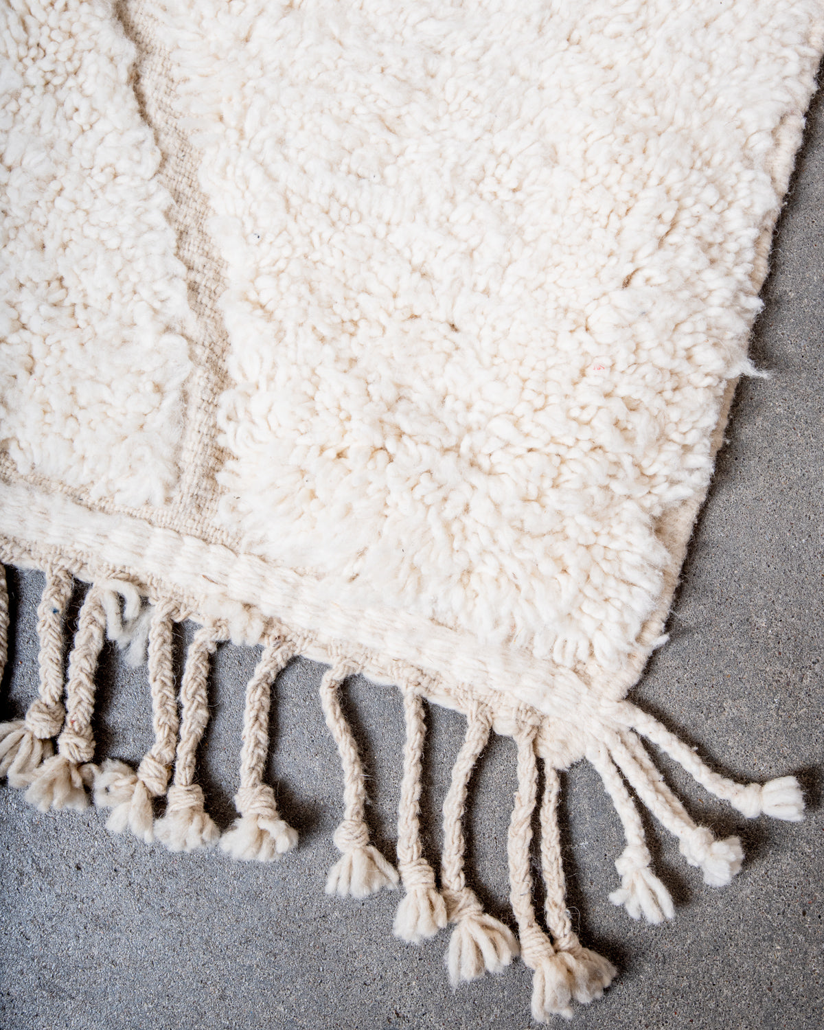 Modern, designer, handcrafted Berber rug from Morocco. Beniourain carpet with minimalist design, natural wool pile and a fluffy texture.
